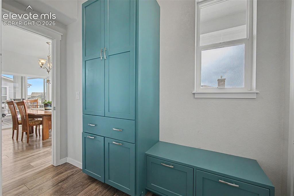 Image 10 of 45: Step into this custom mud room from the 3-car garage where you can store al