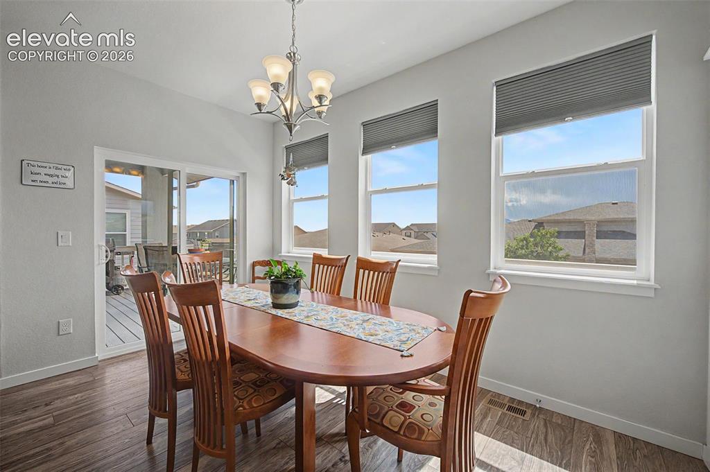 Image 14 of 45: The bright dining area is perfect for daily meals and entertaining. This ro
