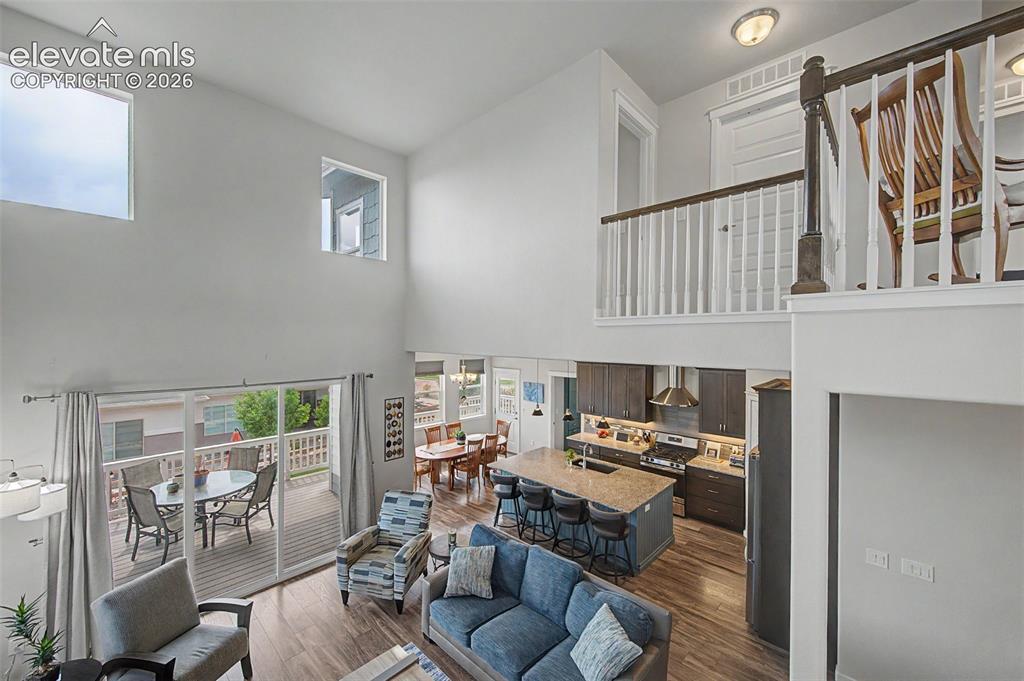 Image 17 of 45: View of the open living area from the stairs to the upper level.