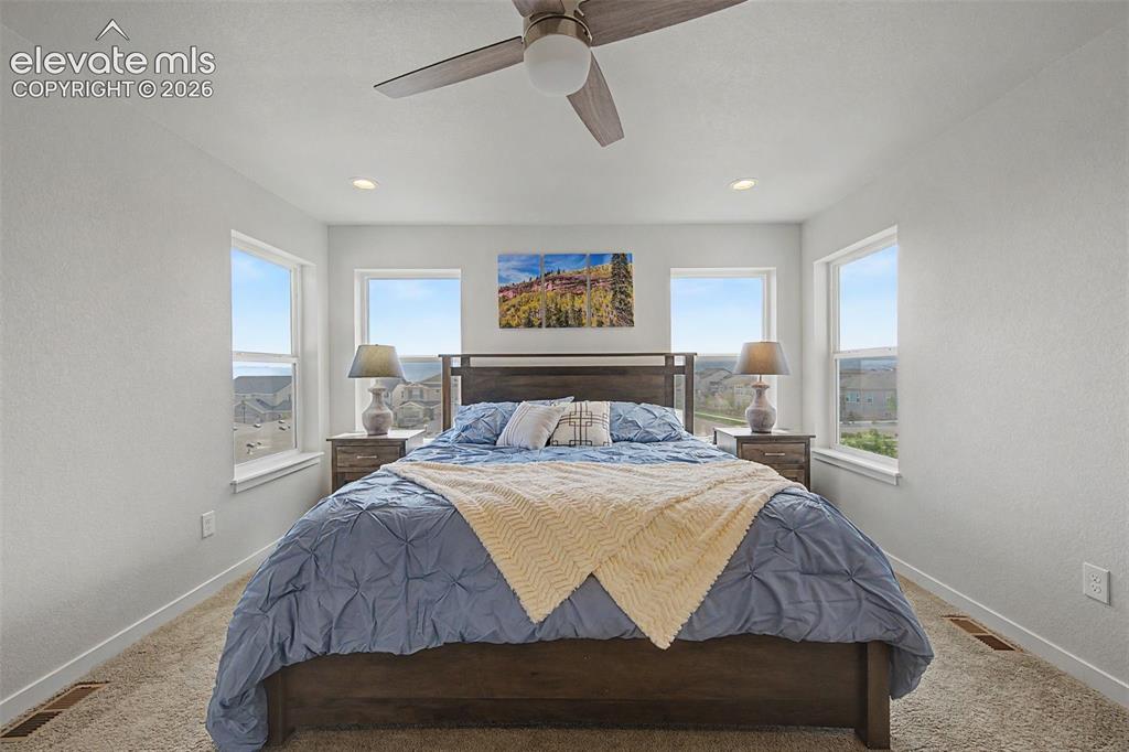 Image 23 of 45: The primary bedroom provides spectacular mountain views!