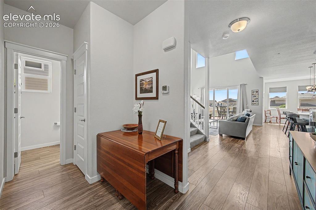 Image 3 of 45: Step into the foyer and marvel at the view of the open living area bathed i