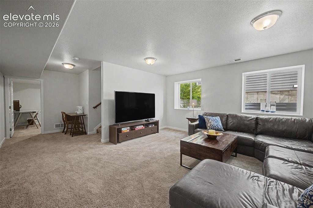 Image 34 of 45: The basement family room is so spacious! Enjoy gatherings with family and f
