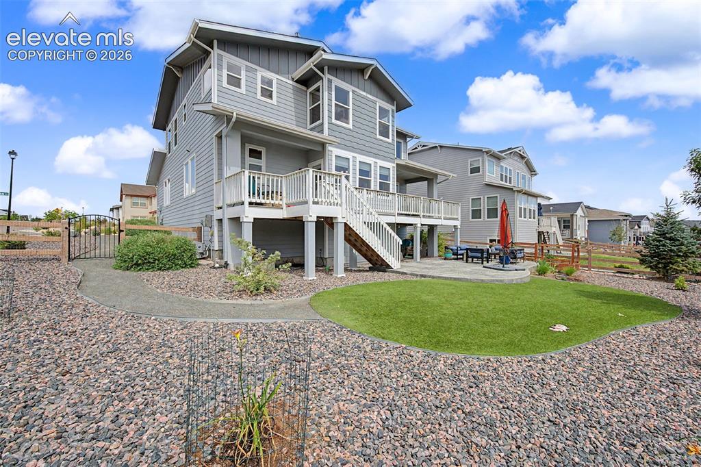 Image 41 of 45: The beautifully landscaped yard can be enjoyed from the expansive deck whic