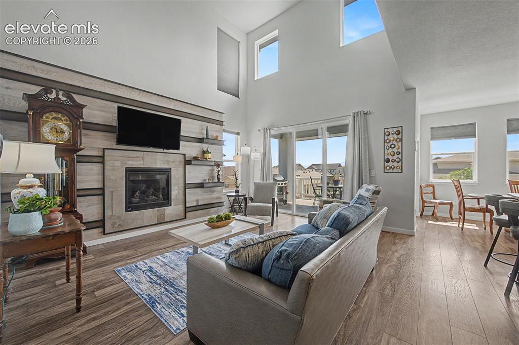 Image 6 of 45: The dramatic 2-story ceilings add a bright and airy feel to the living area