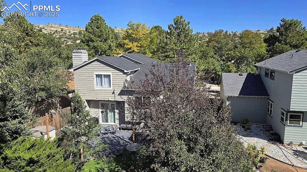 Image 30 of 41: View of front facade featuring a chimney