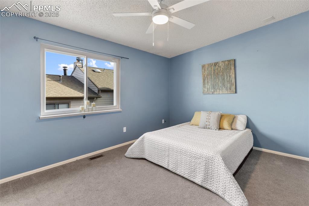 Image 22 of 26: Upper Level Bedroom