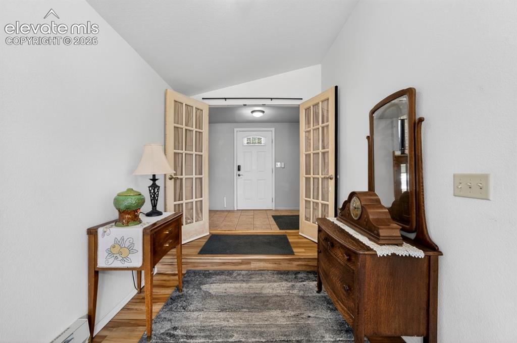 Image 12 of 42: Main Floor- Entryway featuring wood-finish flooring, light grey wall paint,
