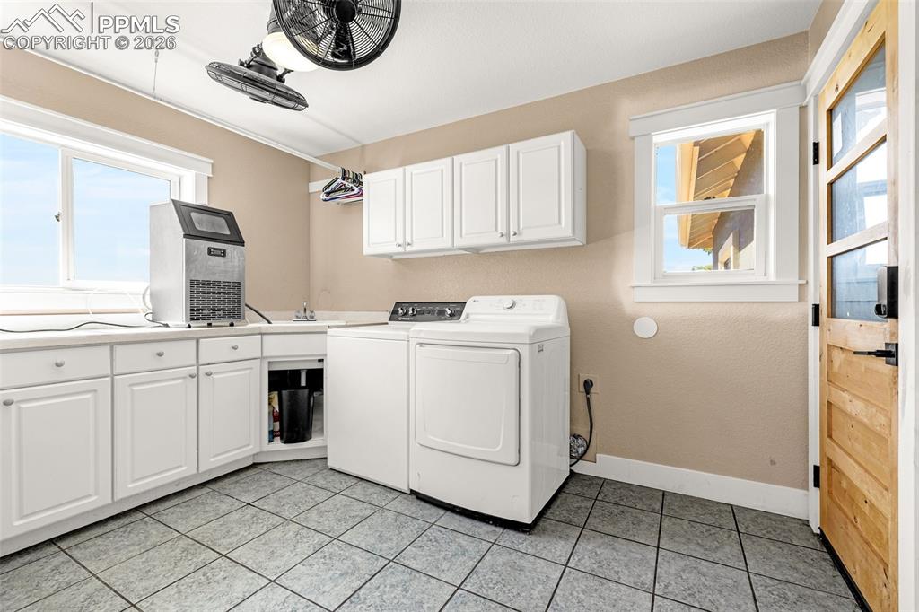 Image 18 of 48: Main level laundry room w/ garage access