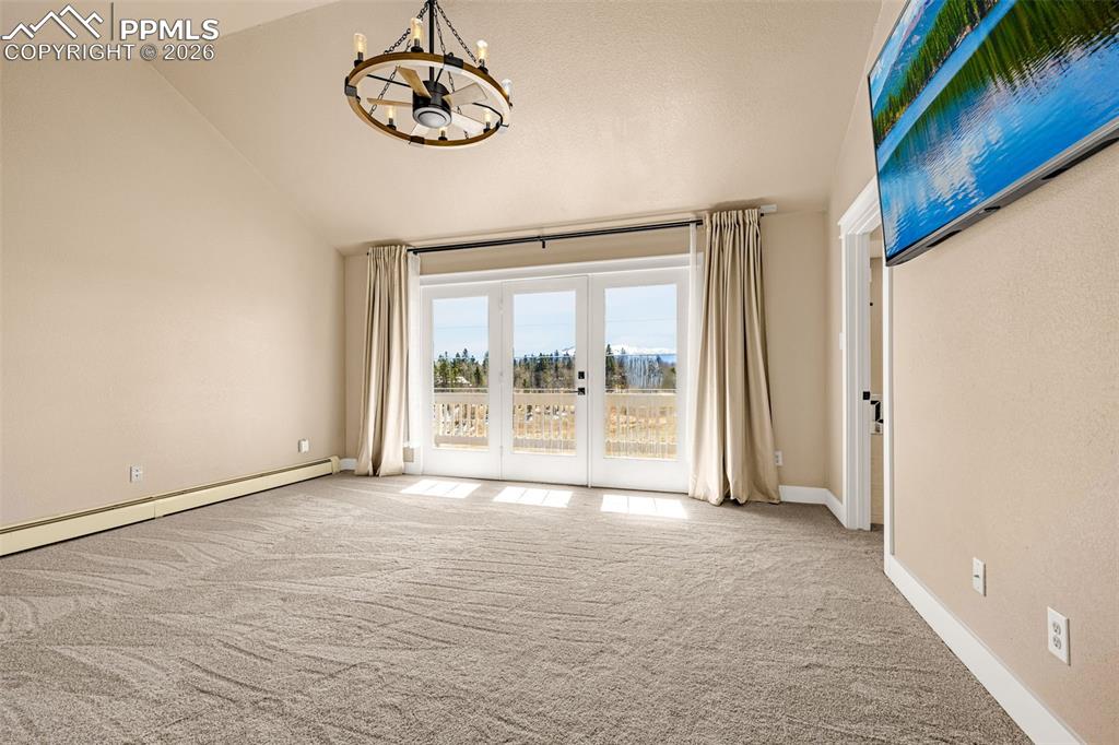 Image 21 of 48: Primary Bedroom with Juliet balcony