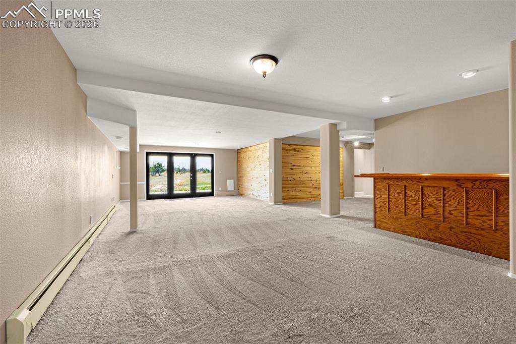 Image 34 of 48: Lower level family room w/ walk out