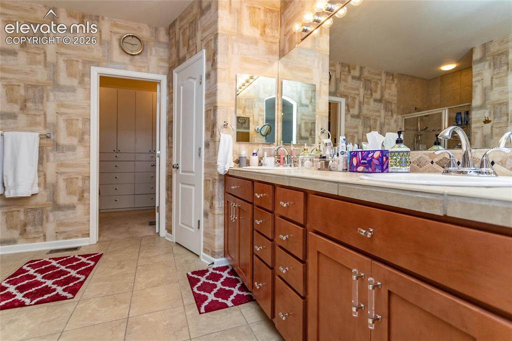 Image 21 of 48: Spacious with double sinks, room for all of your personal items.