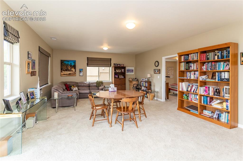 Image 32 of 48: Spacious family room...plenty of room for games & movie watching.