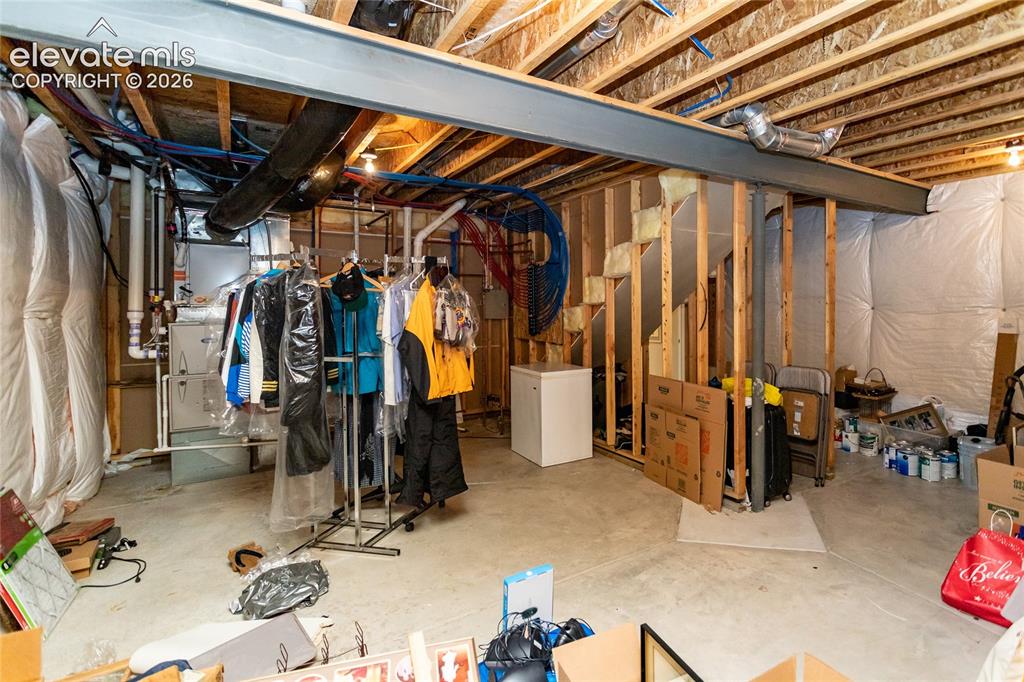 Image 39 of 48: Unfinished basement area...plenty of room for all of your storage & holiday