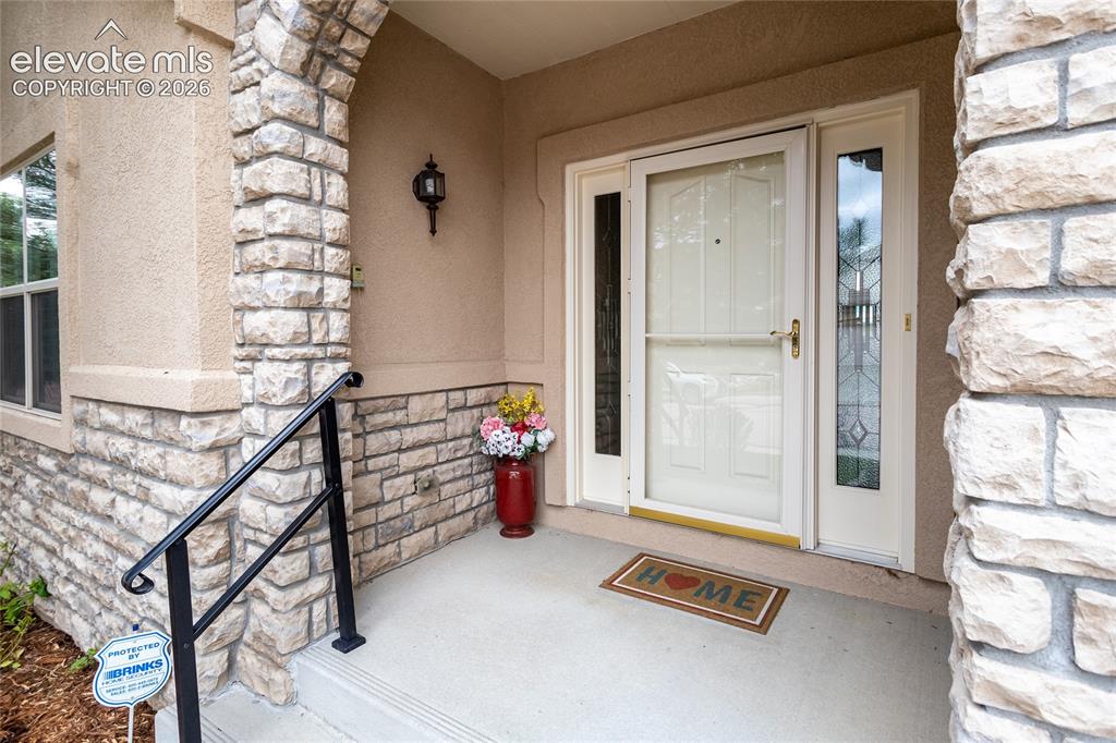 Image 4 of 48: Stone accents invite you to come in & explore.