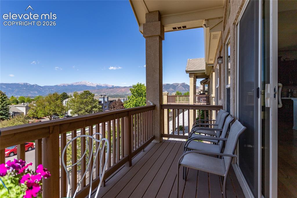 Image 41 of 48: Comfy deck for relaxing, enjoying a meal or just watching your neighbors dr