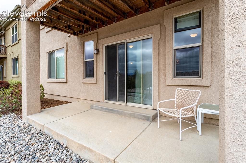 Image 46 of 48: Lower patio off of the family room. Another cozy spot to entertain.