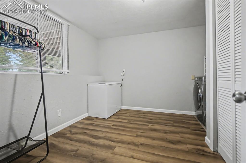 Image 24 of 36: Large laundry room with window. Washer and dryer included! 
