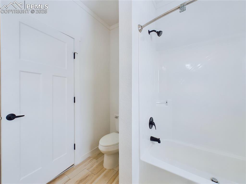 Image 42 of 50: Bathroom with shower / bath combination and toilet...