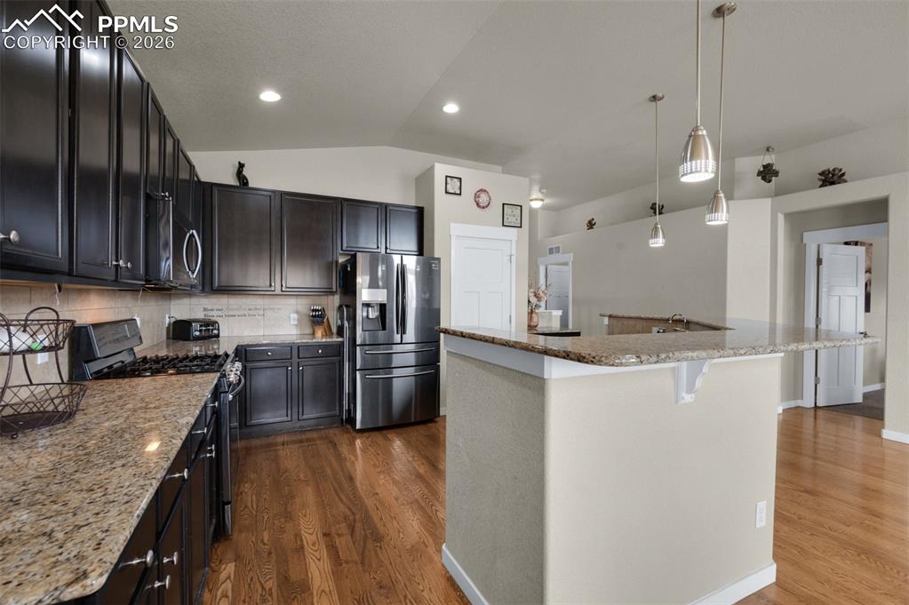 Image 11 of 31: Kitchen showing pantry in background