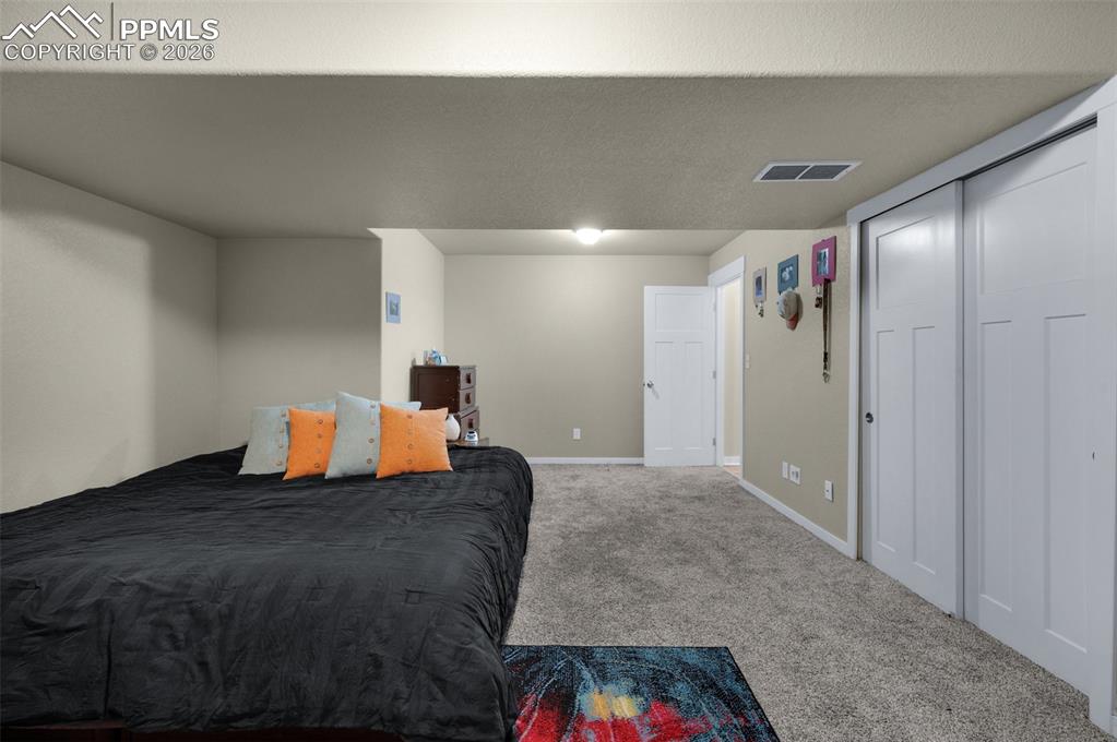 Image 26 of 31: Basement bedroom