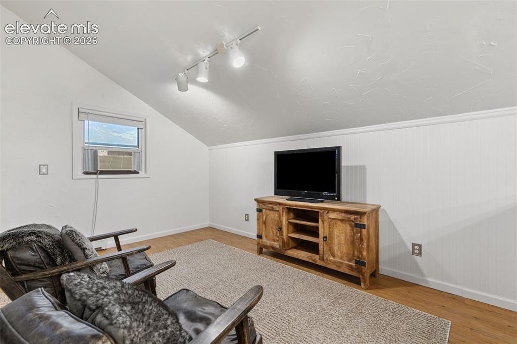 Image 29 of 48: Upper Level TV, office, play room