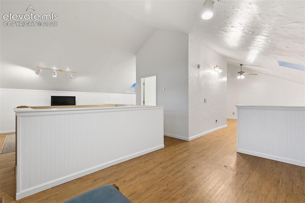 Image 31 of 48: Upper Level TV, office playroom area