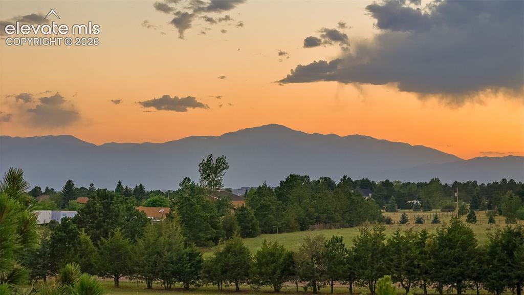 Image 48 of 48: East side of property fully fenced, towards Pikes Peak