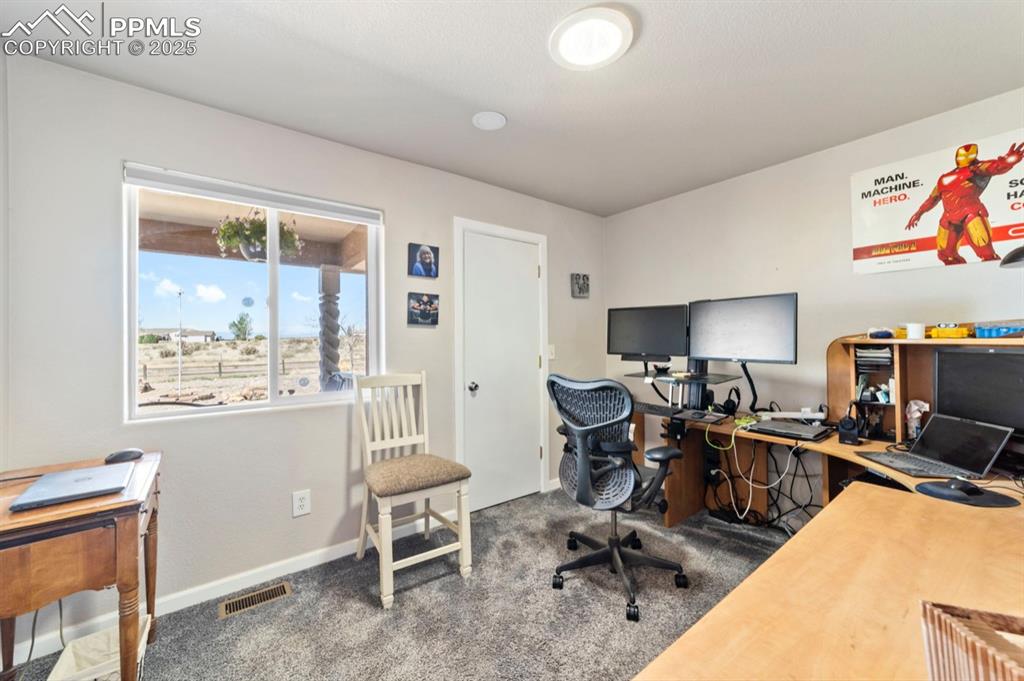 Image 14 of 21: Office featuring carpet floors, baseboards, and visible vents