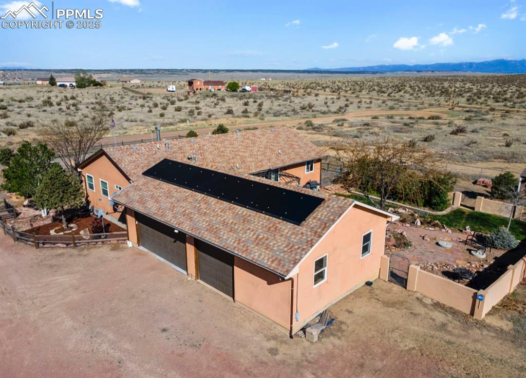 Image 3 of 21: Birds eye view of property with a rural view and a desert view