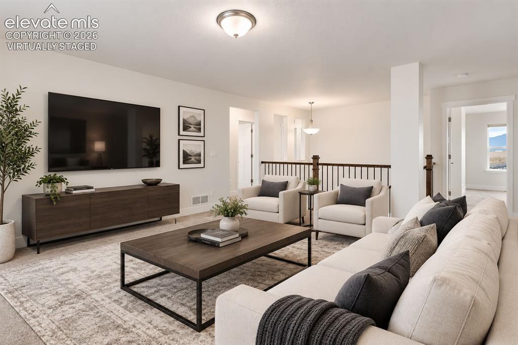 Image 19 of 50: Virtually staged: Open-concept upper-level living area