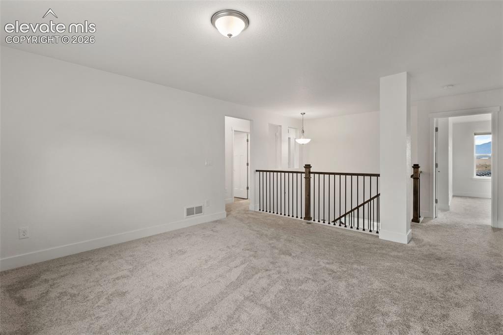 Image 20 of 50: Open-concept upper-level living area