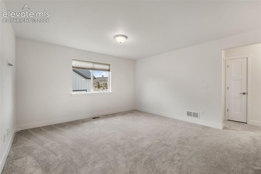 Image 28 of 50: Recessed window with white trim, neutral wall color, overhead flush mount l