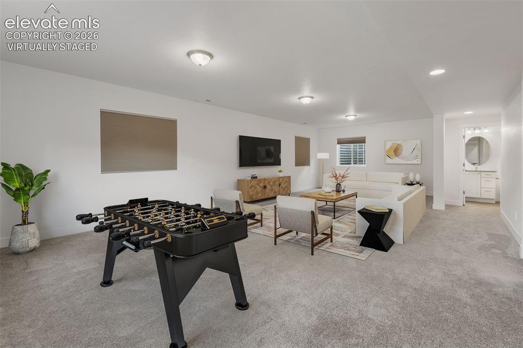 Image 34 of 50: Virtually staged:  Spacious finished lower level featuring recessed lightin