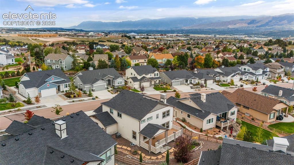 Image 45 of 50: Residential neighborhood featuring a consistent architectural style, paved 