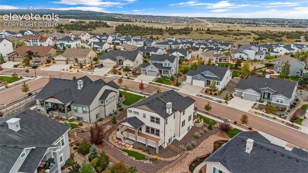 Image 46 of 50: Expansive residential community featuring diverse architectural styles, pav