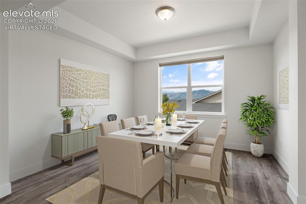 Image 5 of 50: Virtually Staged: wood-finish LVP flooring, and a window with mountain view