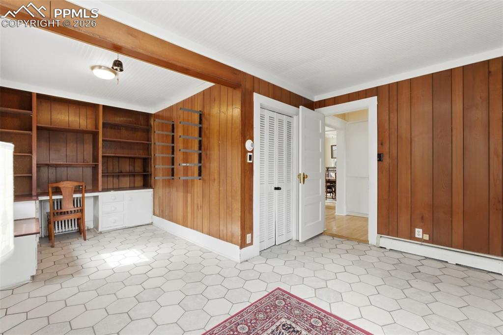 Image 13 of 39: Main Level Office with Built-ins