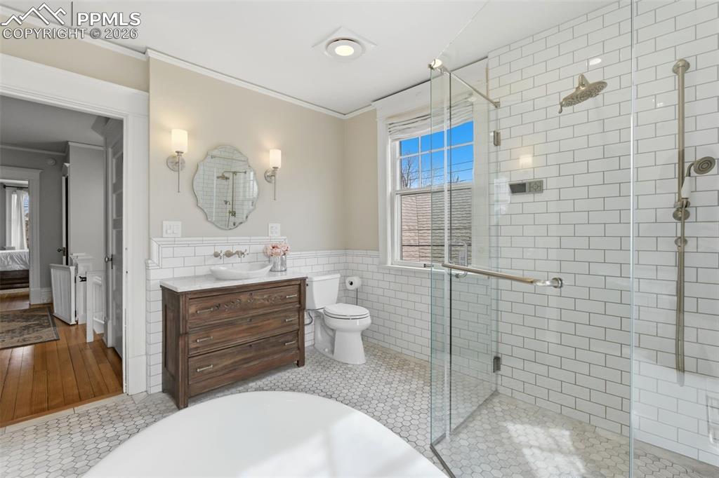 Image 20 of 39: Remodeled Full Bathroom with Radiant Heated Floors