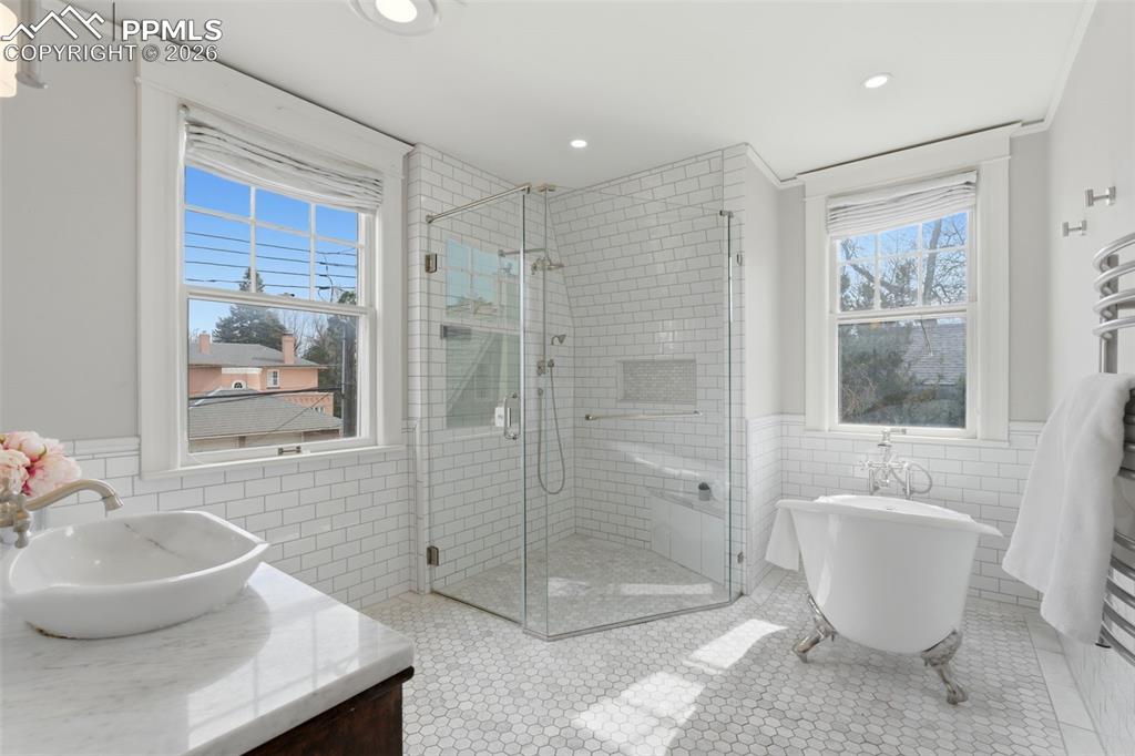 Image 21 of 39: Remodeled Full Bathroom with Claw Foot Tub and Radiant Heated Floors