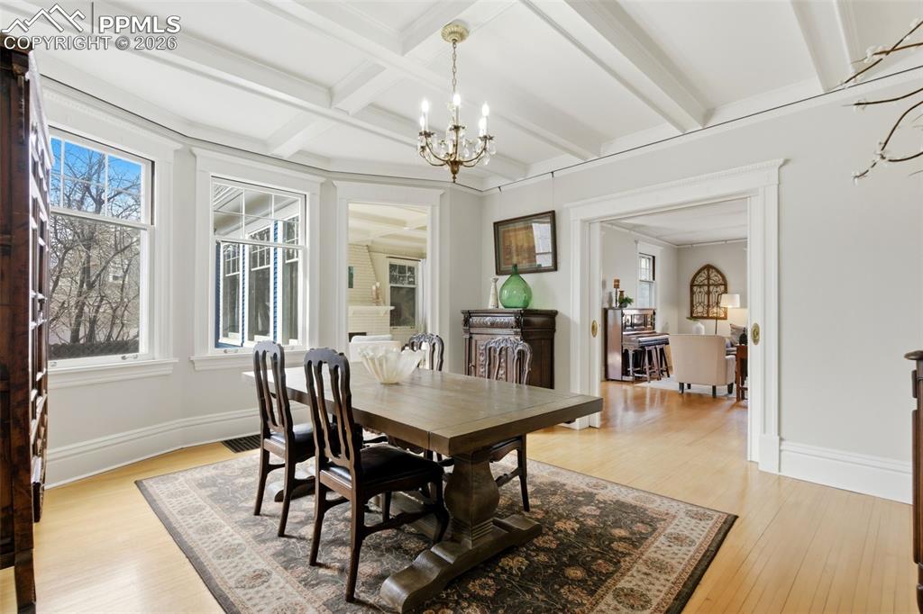 Image 8 of 39: Formal Dining Room with Hardwood Flooring