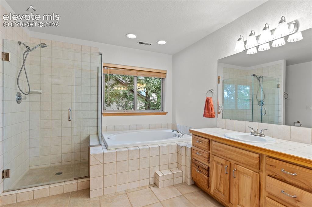 Image 18 of 39: primary bathroom