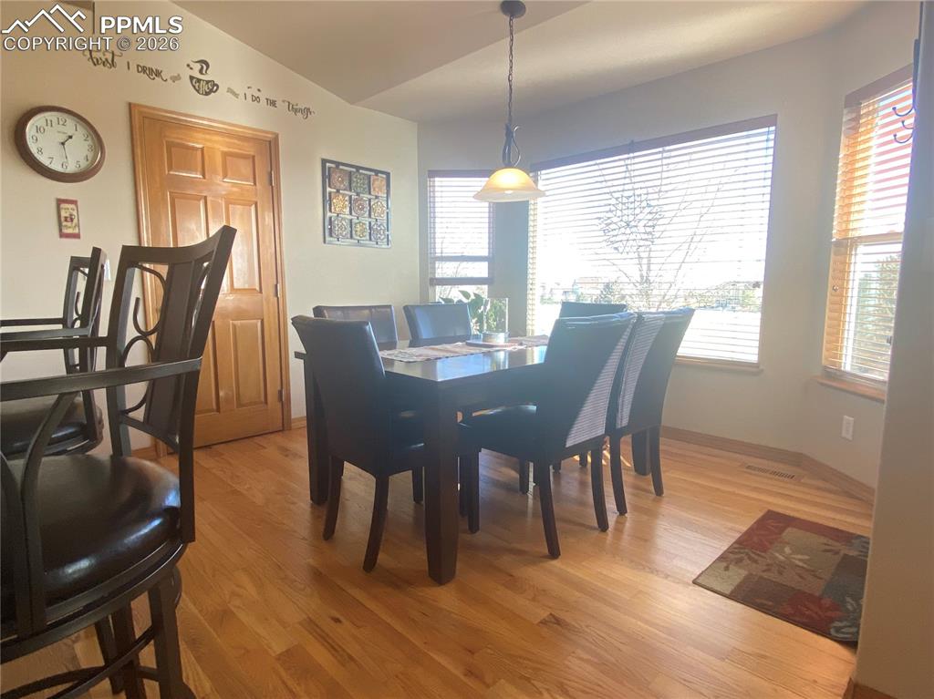 Image 15 of 47: The eat-in dining room has golf course views