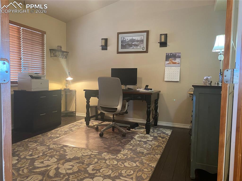Image 4 of 47: This functional office was created from an unused formal dining room