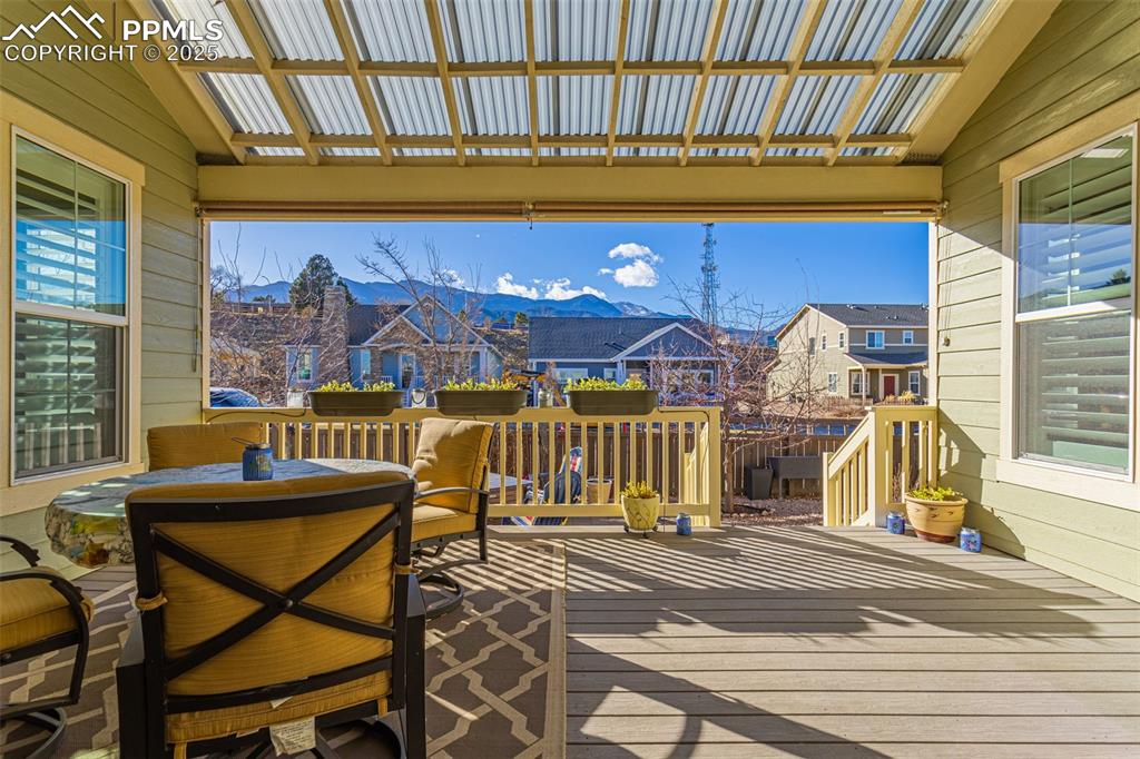 Image 22 of 42: Wooden terrace featuring a mountain view and a pergola