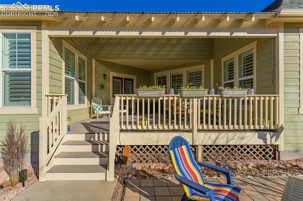 Image 25 of 42: Wooden terrace featuring a porch