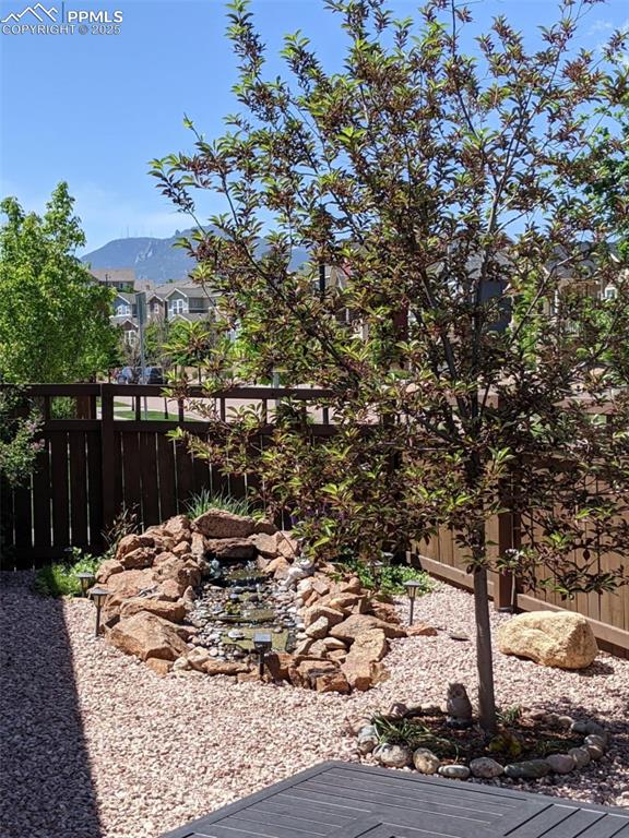 Image 35 of 42: View of yard with a mountain view