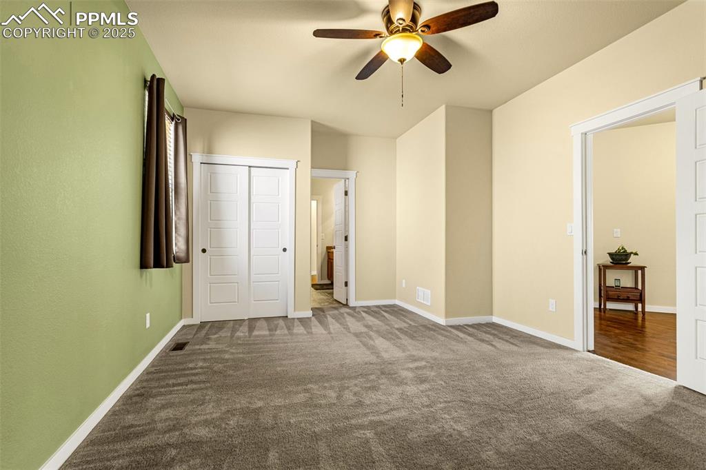 Image 9 of 42: Unfurnished bedroom featuring carpet flooring and ceiling fan