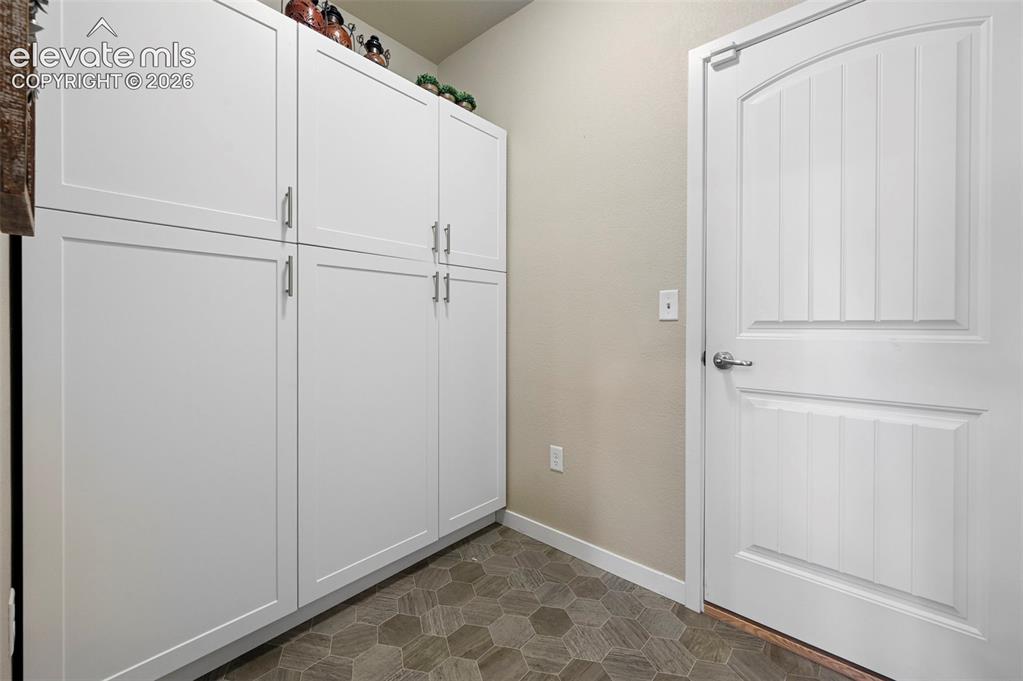 Image 16 of 50: Mud room with added storage