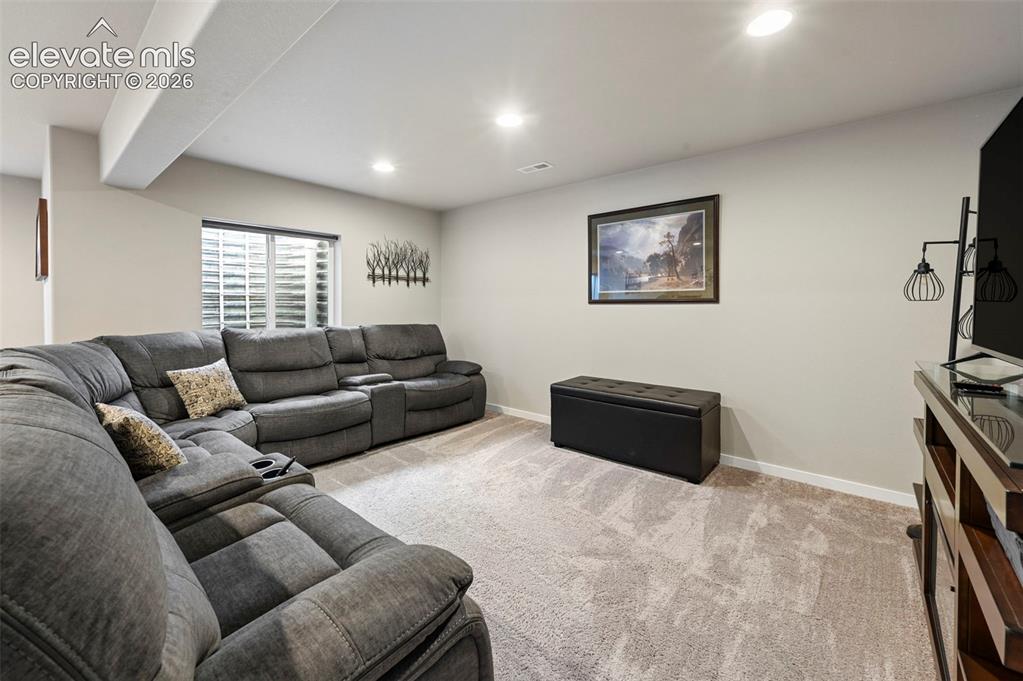 Image 33 of 50: Large family room area in basement