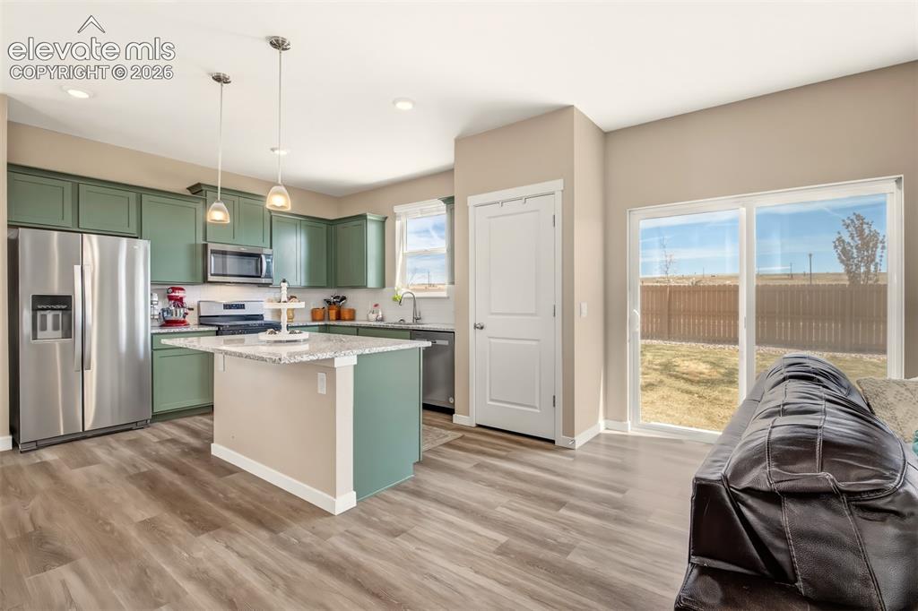 Image 5 of 35: Pantry, stainless steel upgraded appliances and walk out